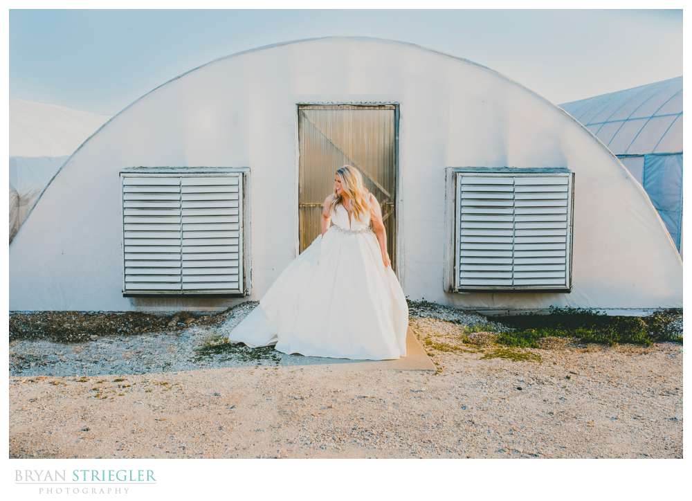 bridal portrait in front of greenhouse